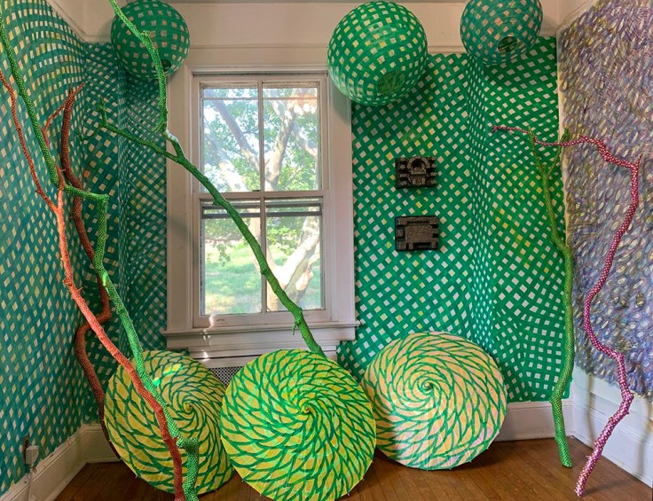 small room with painted walls and objects