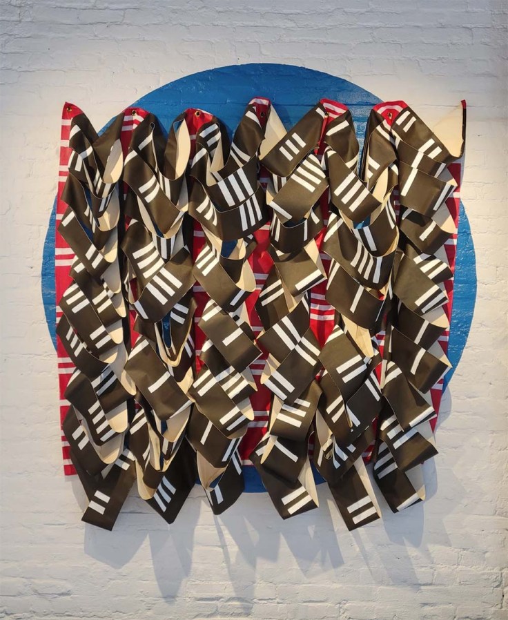 wall hanging of canvas strips painted with stripes